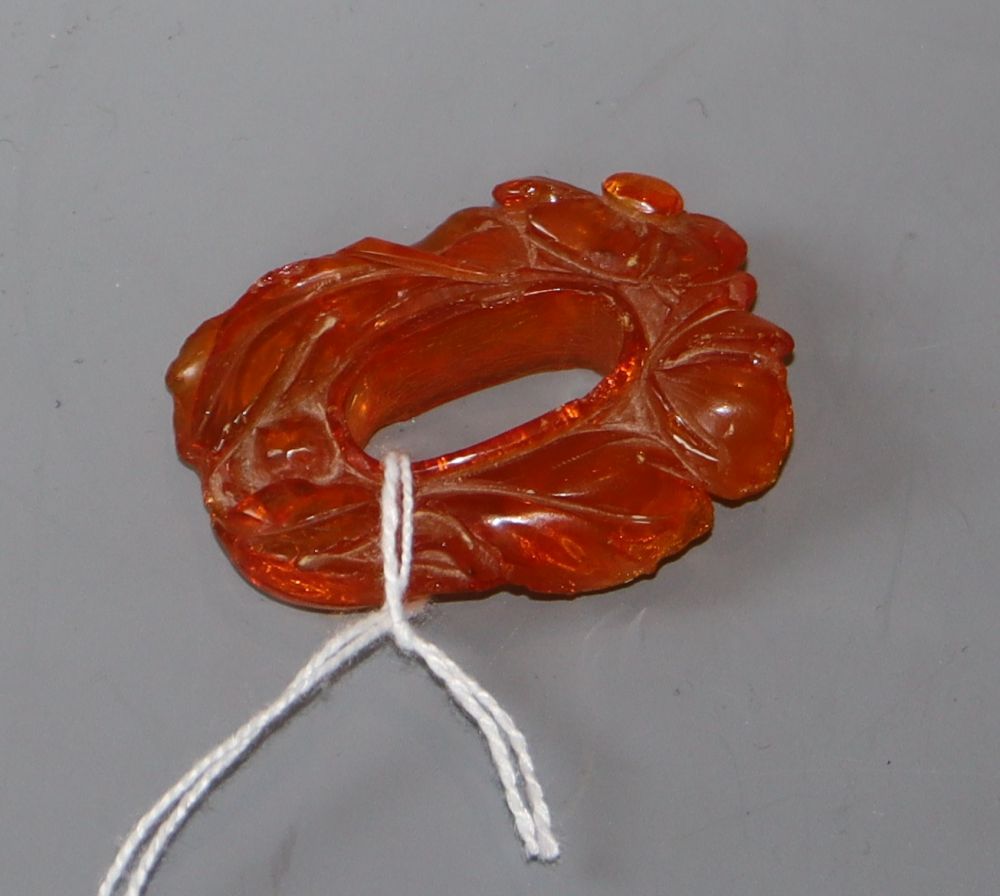A Chinese carved amber pendant